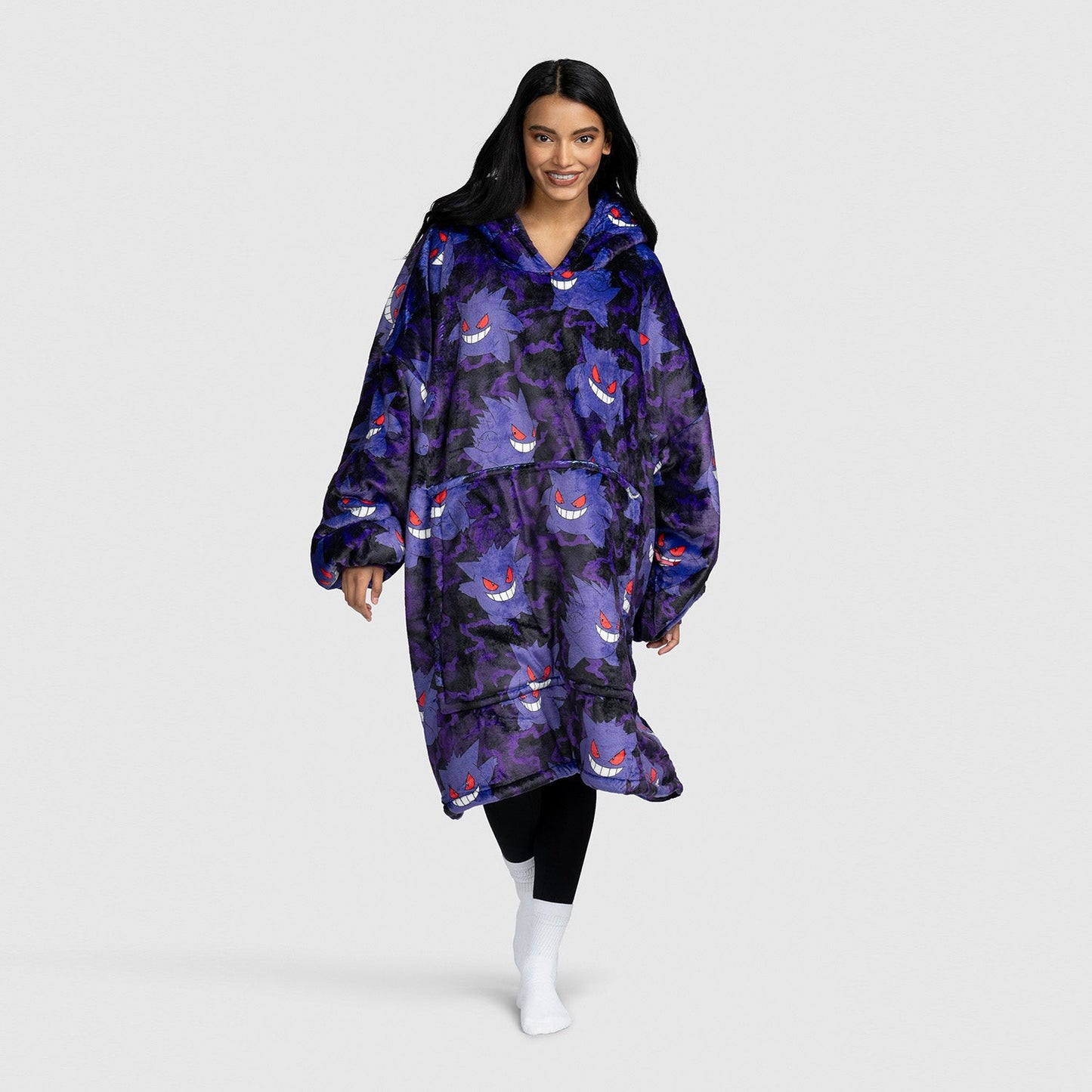 Woman wearing a purple wearable blanket with a Gengar Pokémon pattern