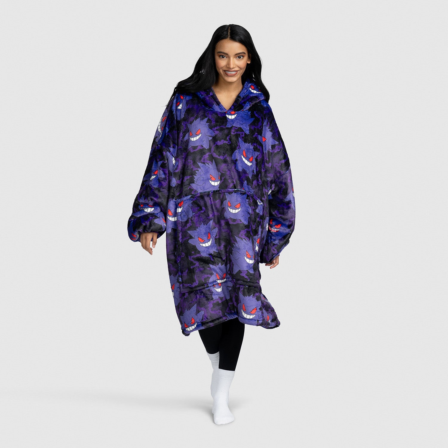 Woman wearing a purple wearable blanket with a Gengar Pokémon pattern