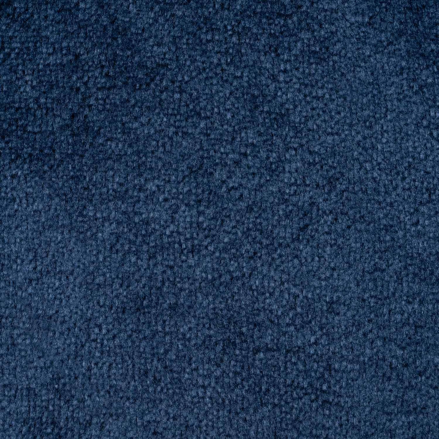 Close-up texture of blue fabric or carpet with a dense, looped pile.