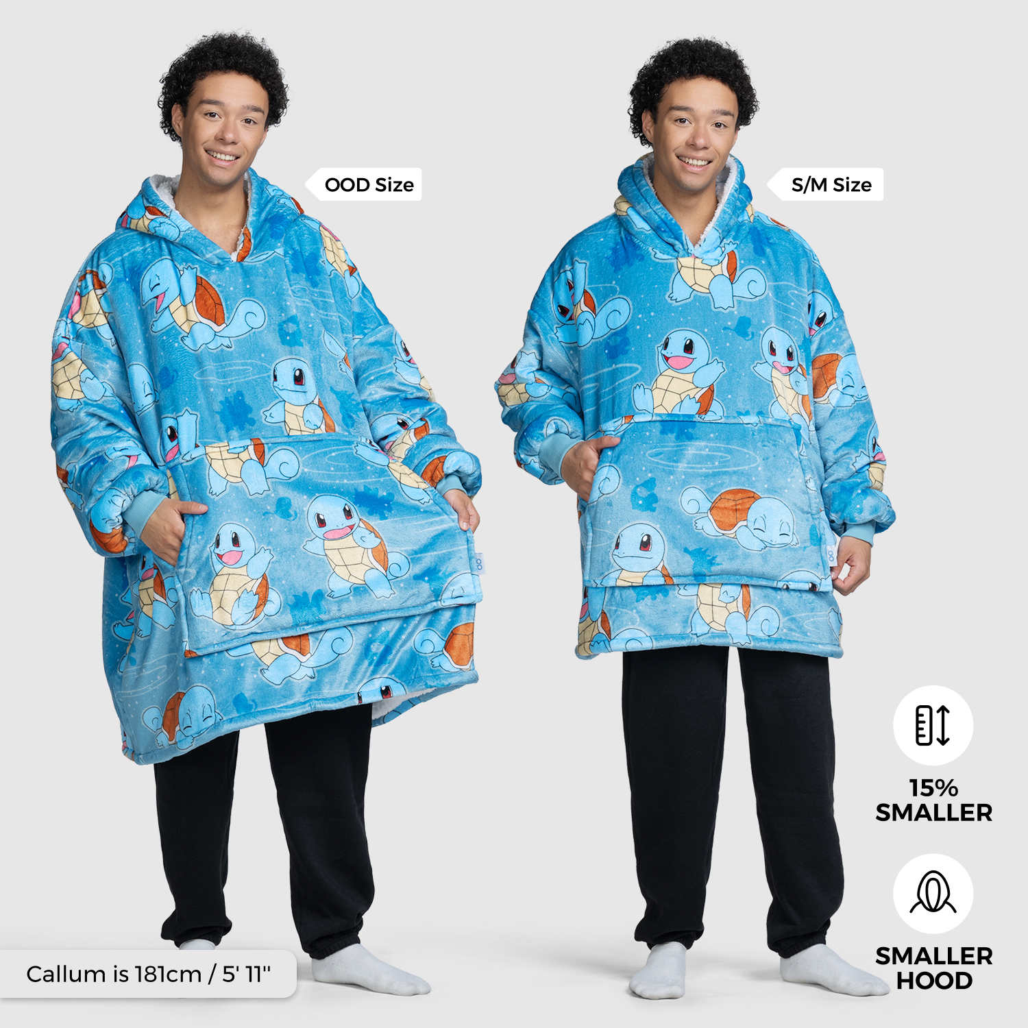 Person modeling two sizes of a blue Squirtle-themed wearable blanket, labeled OOD Size and S/M Size, with text 'Callum is 181cm / 5' 11"', '15% SMALLER', and 'SMALLER FIT' visible.