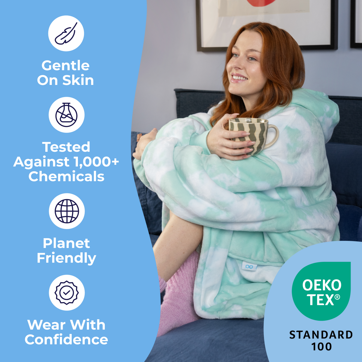 Woman wrapped in a cozy Oodie holding a mug, next to text: Gentle On Skin, Tested Against 1,000+ Chemicals, Planet Friendly, Wear With Confidence, and OEKO TEX STANDARD 100 logo.