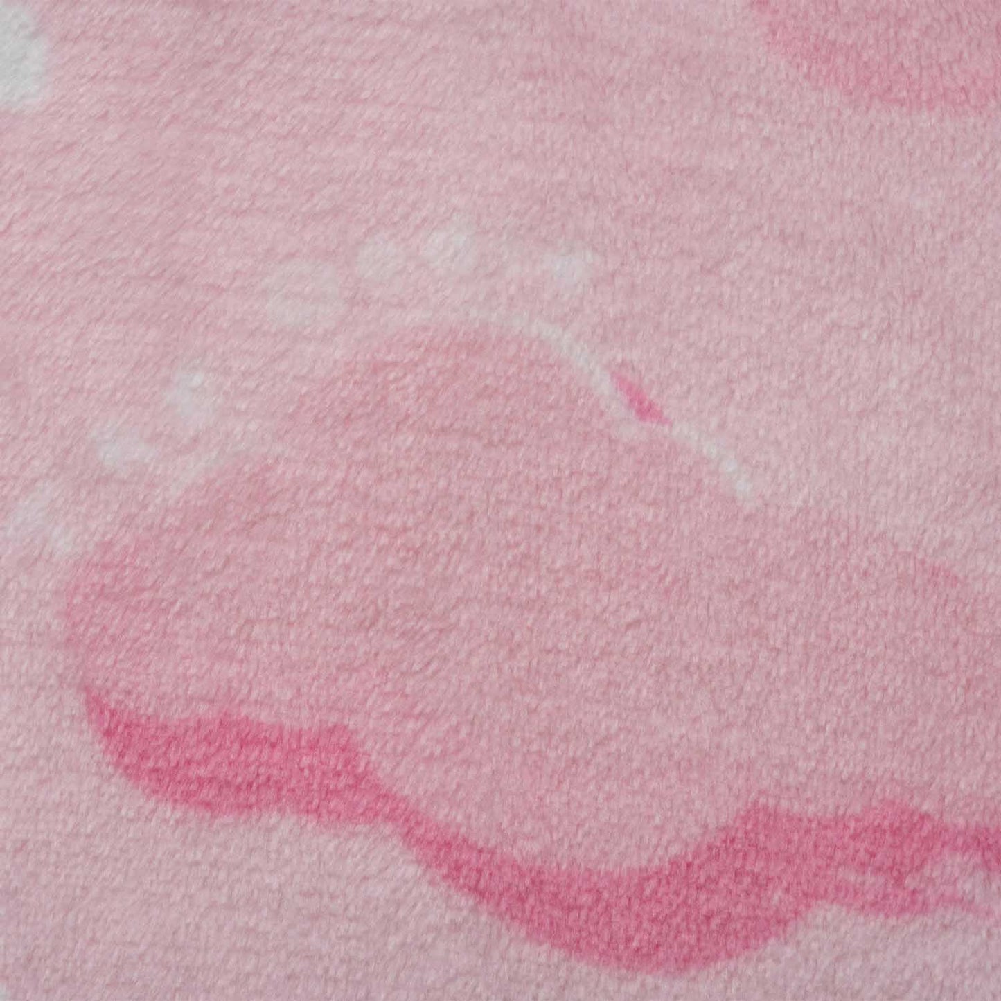 Close-up of pink fabric with a cloud shape and paw prints pattern