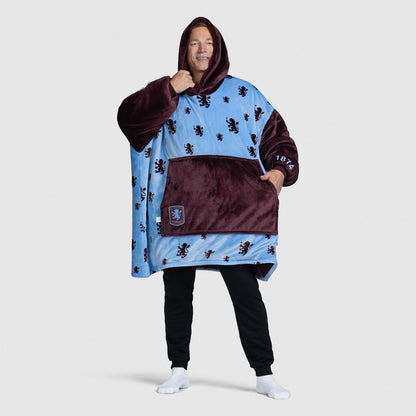 Man wearing a blue and maroon hooded wearable blanket with lion patterns, standing with one hand in pocket size: Steven is 6” wearing a size OOD