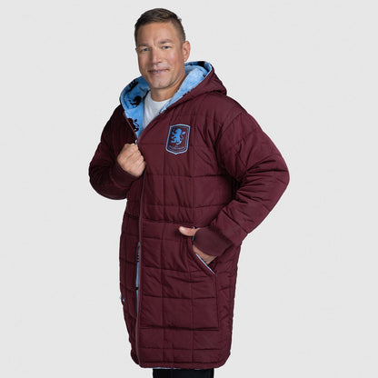 Man wearing a maroon quilted hooded coat with a blue logo patch, standing with one hand in pocket. size: Steven is 6” wearing a size OOD