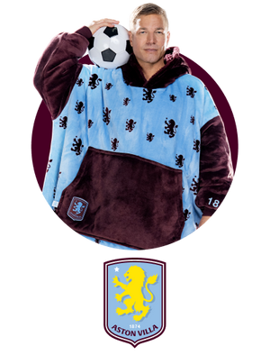 Man wearing a blue and maroon Oodie with lion patterns holding a soccer ball on his shoulder