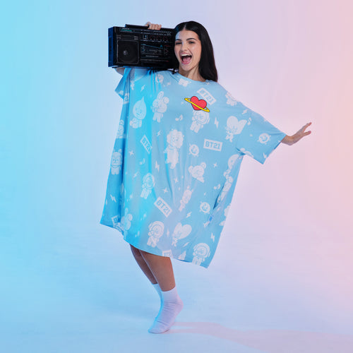 Woman holding a boombox wearing a blue oversized BT21 character print shirt