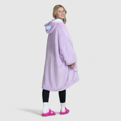 Woman wearing a purple BT21 Mang hoodie blanket with character ears on the hood