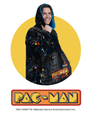 Man wearing a Pac-Man themed Oodie with visible text 'PAC-MAN' and 'PAC-MAN' logo below