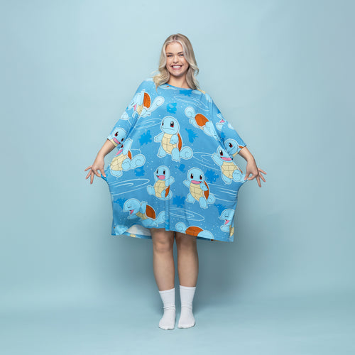 Woman wearing a blue dress patterned with multiple images of the Pokémon Squirtle character