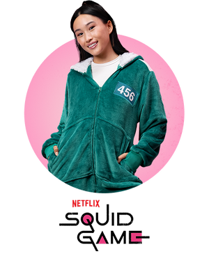 Person wearing green jacket with '456' patch, with visible text 'NETFLIX' and 'SQUID GAME' below